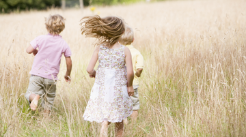 children running on meadows